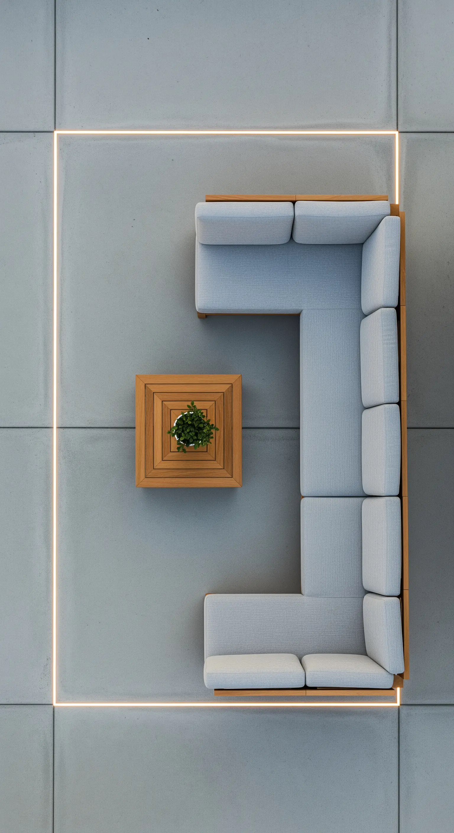 Vista dall'alto di un divano modulare su pavimento in cemento con perimetro luminoso a LED