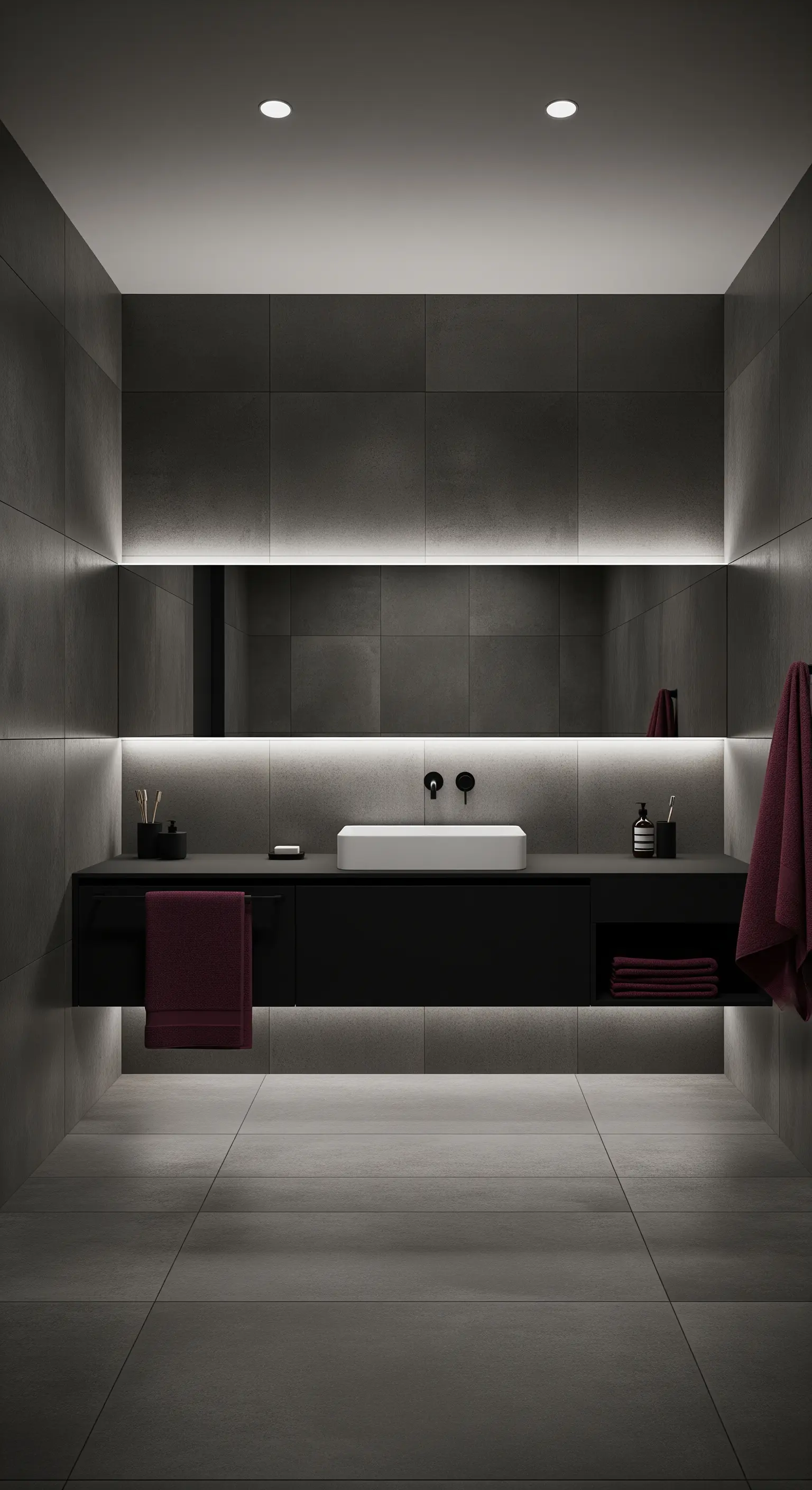 Bagno scuro con mobile nero sospeso e specchio, entrambi retroilluminati da una luce calda.