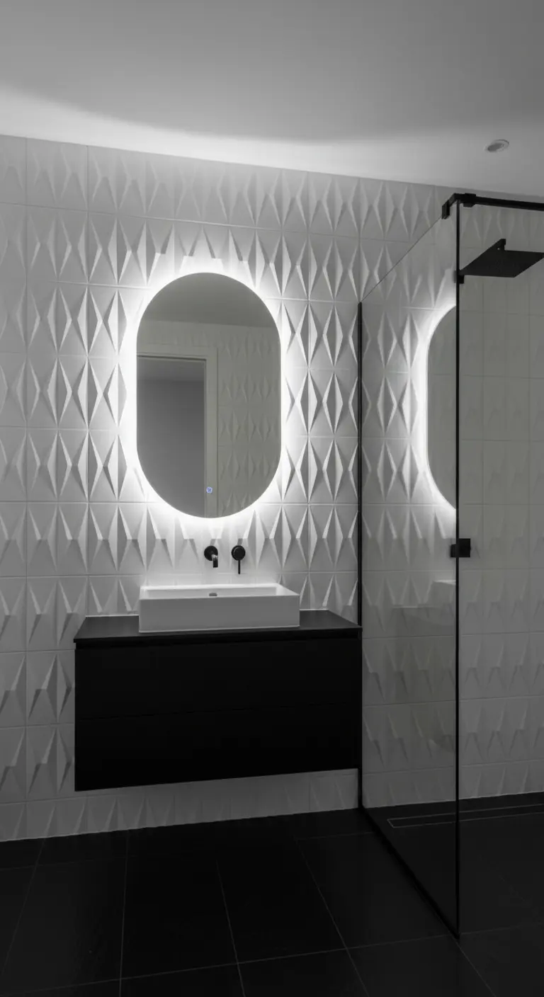 Parete con piastrelle bianche 3D a forma di diamante e specchio ovale retroilluminato.