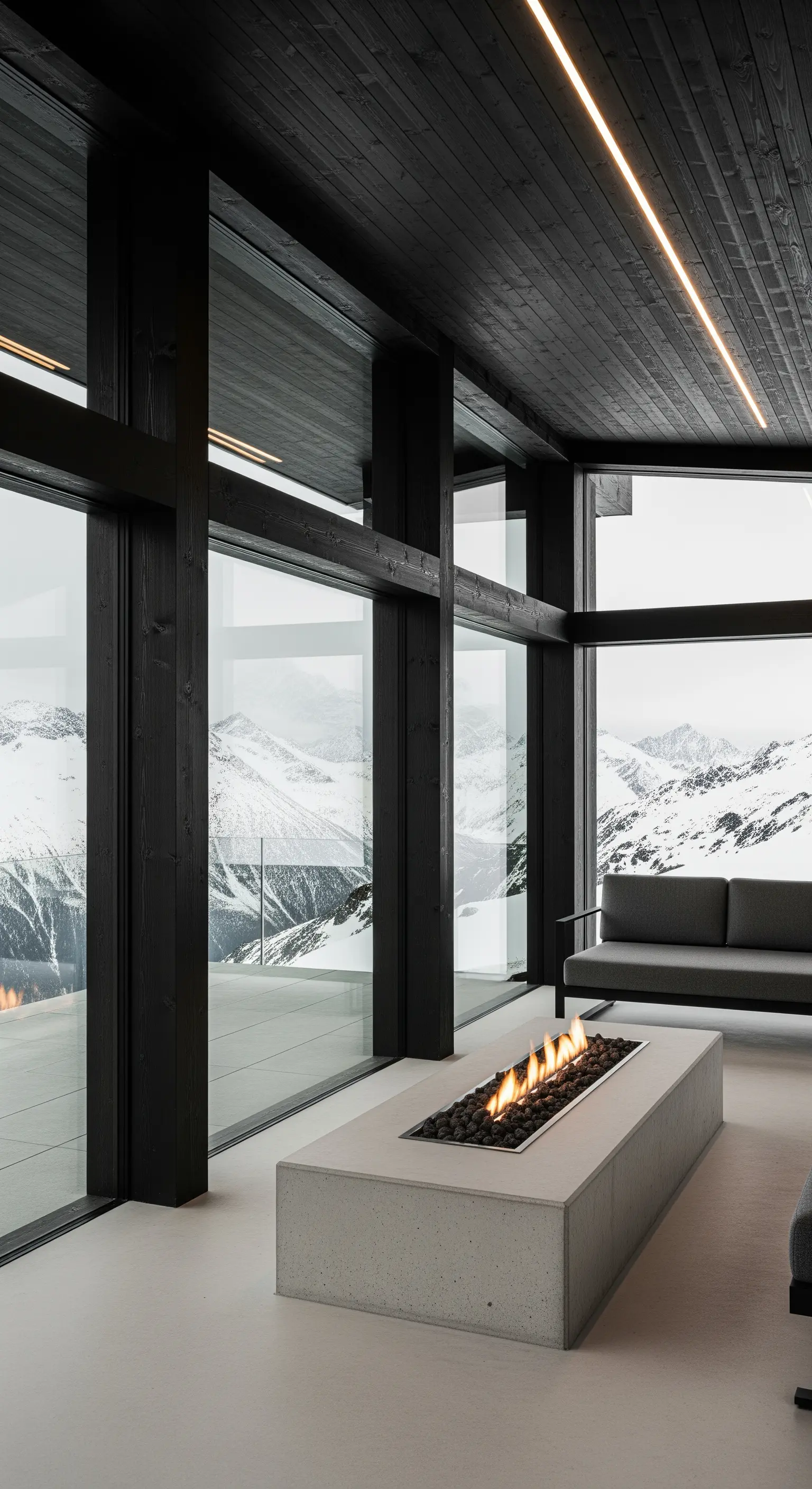Veranda moderna con camino lineare in cemento e ampie vetrate affacciate su montagne innevate