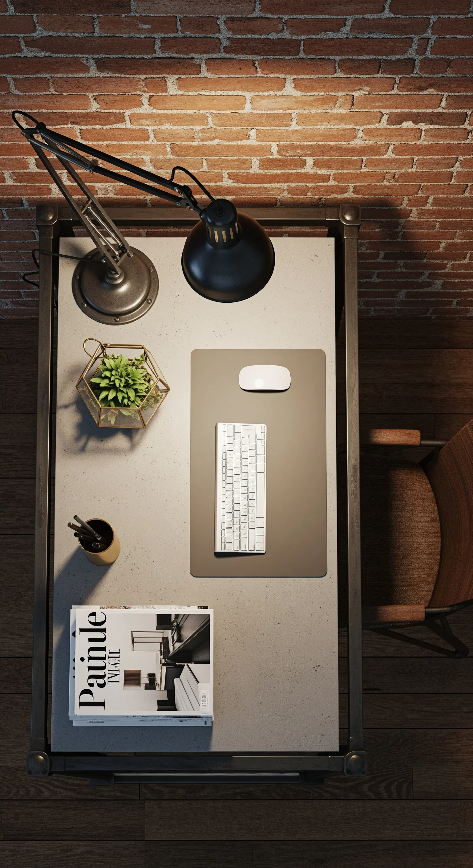 Vista dall'alto di una scrivania con piano in cemento e accessori minimalisti.