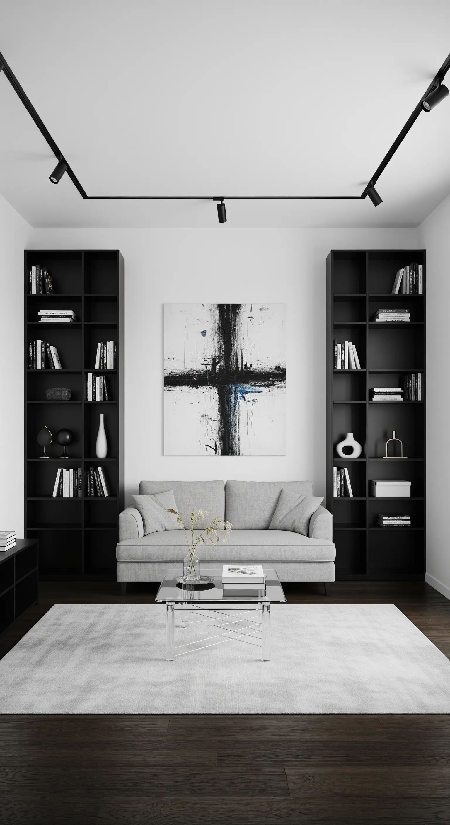 Salotto con divano grigio incorniciato da due alte librerie nere e un quadro astratto