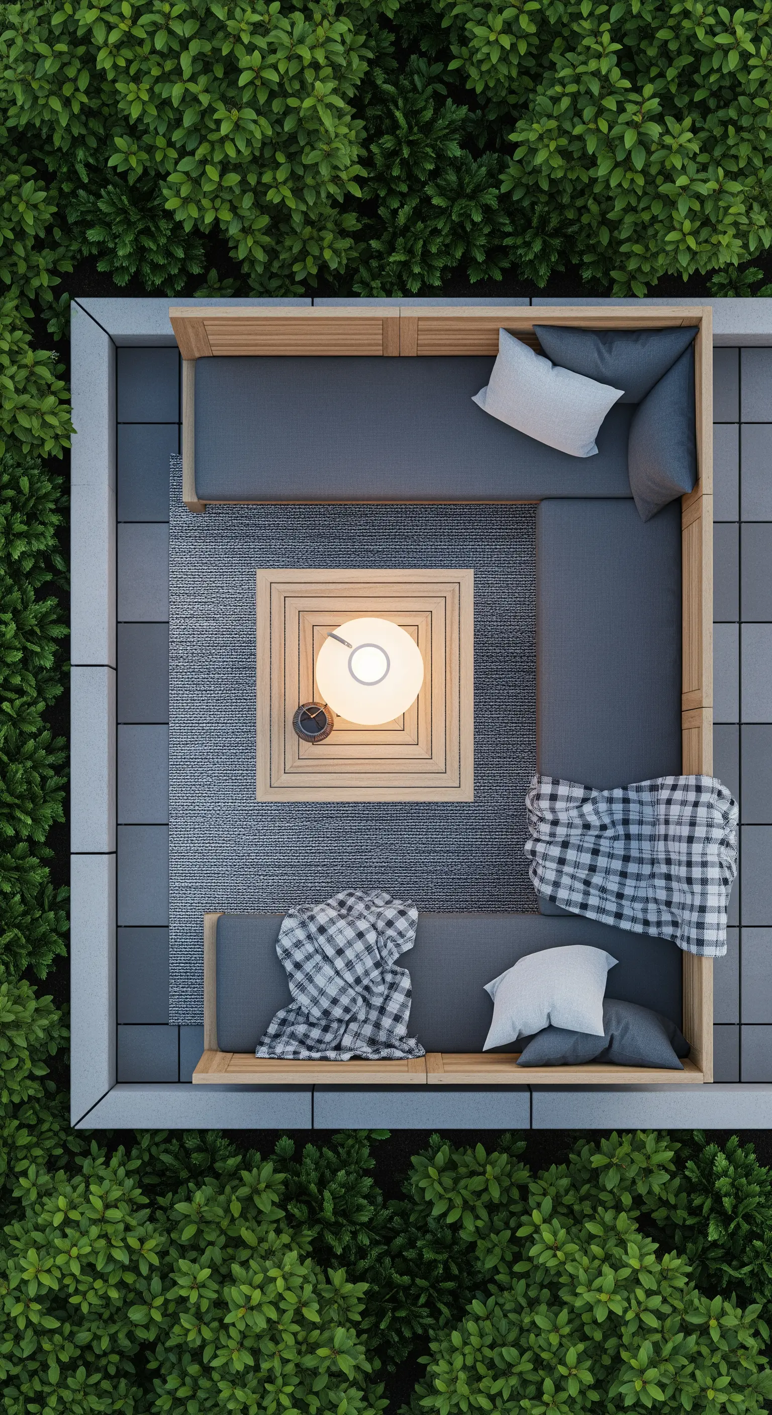 Vista aerea di un patio con divano angolare, tappeto, tavolino e plaid a quadri.